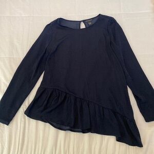 Chelsea & Theodore top with asymmetrical ruffle hem